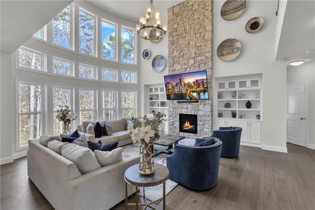 244 Wild Rose Circle Canton, GA 30115 - Photo 11 of 55 a living room with furniture a fireplace and a large window