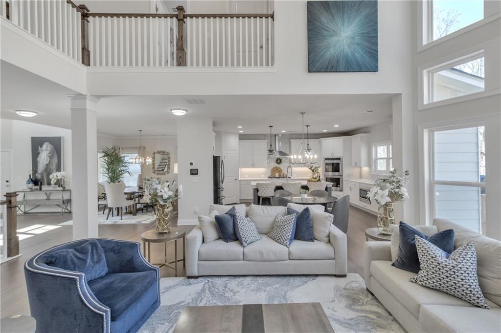 244 Wild Rose Circle Canton, GA 30115 - Photo 14 of 55 a living room with furniture kitchen view and a chandelier
