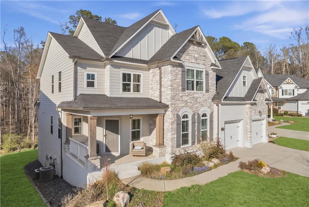 244 Wild Rose Circle Canton, GA 30115 - Photo 2 of 55 a front view of a house with garden