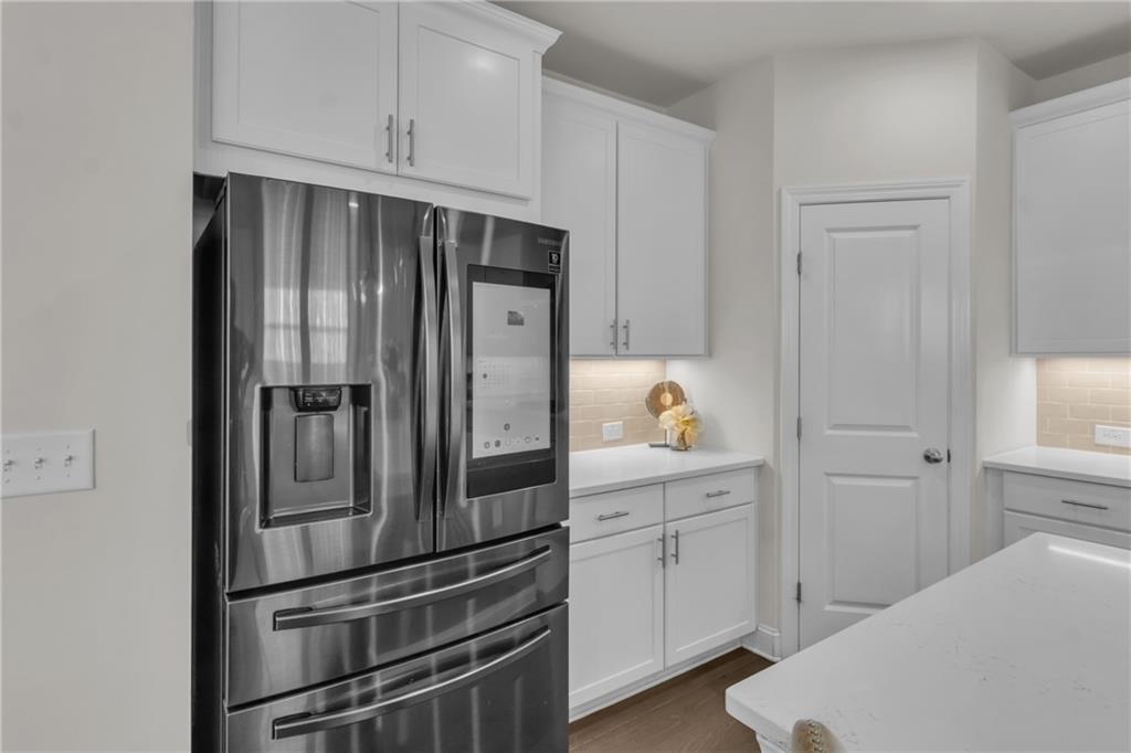 244 Wild Rose Circle Canton, GA 30115 - Photo 21 of 55 a kitchen with cabinets stainless steel appliances and cabinets