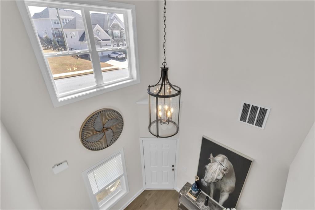 244 Wild Rose Circle Canton, GA 30115 - Photo 29 of 55 a front view of a house with wooden floor and windows