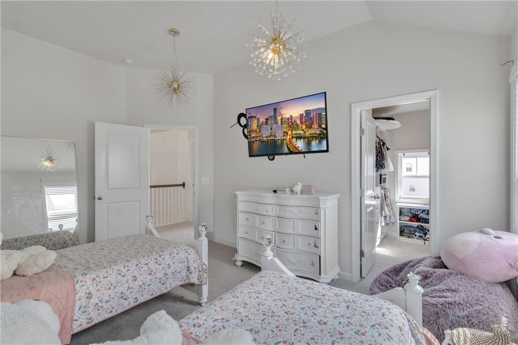 244 Wild Rose Circle Canton, GA 30115 - Photo 32 of 55 a bedroom with a bed and a flat screen tv