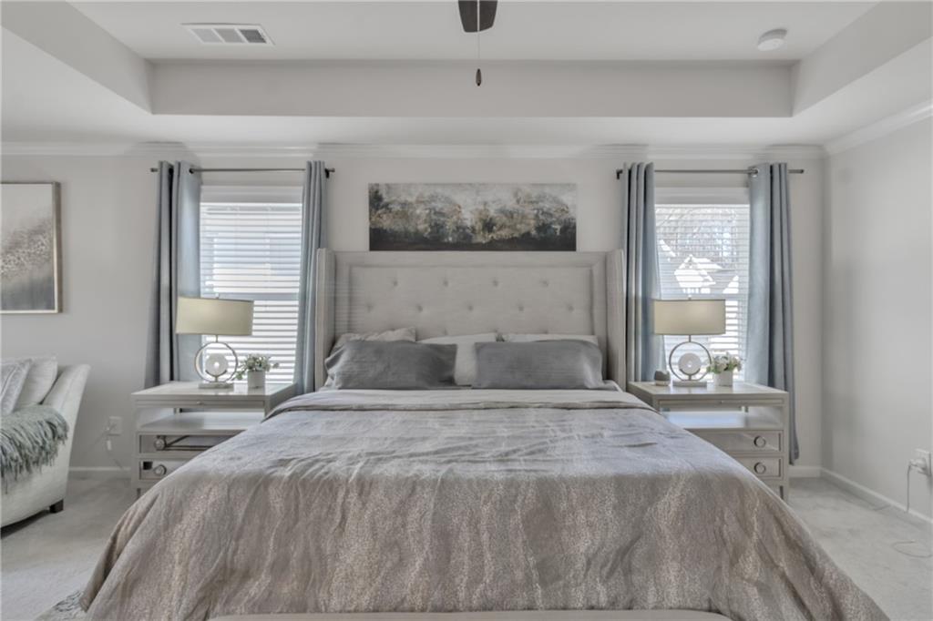 244 Wild Rose Circle Canton, GA 30115 - Photo 35 of 55 a bedroom with a large bed and a window