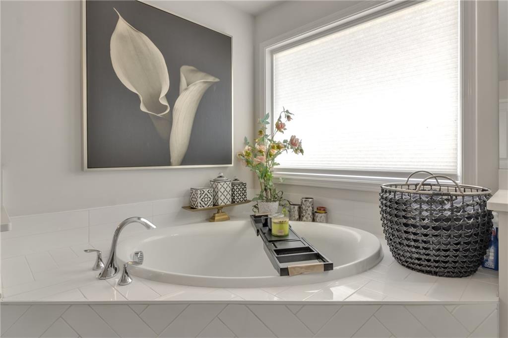 244 Wild Rose Circle Canton, GA 30115 - Photo 38 of 55 a bathroom with a mirror and a sink