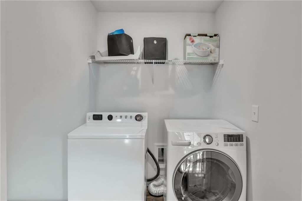 244 Wild Rose Circle Canton, GA 30115 - Photo 41 of 55 a utility room with dryer and washer