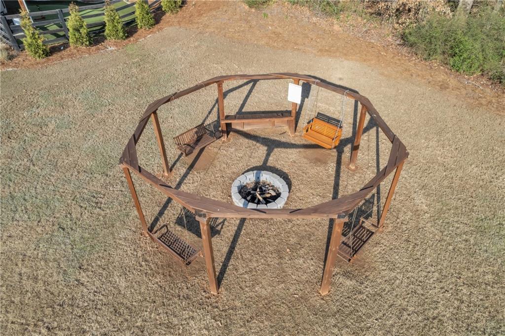 244 Wild Rose Circle Canton, GA 30115 - Photo 49 of 55 a view of staircase with a table and a chair