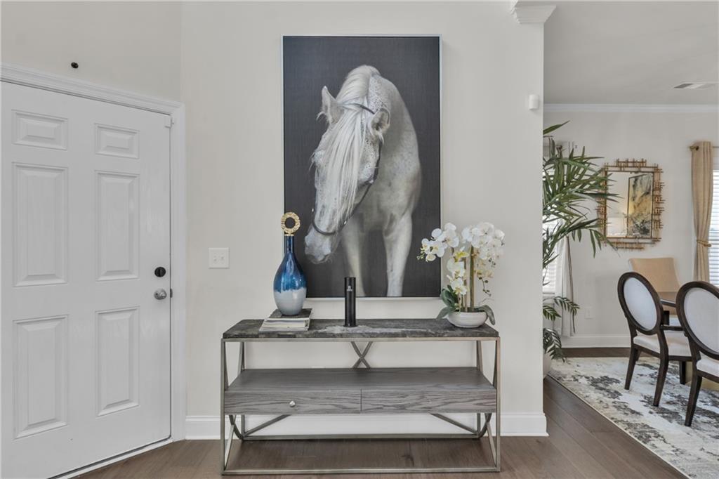 244 Wild Rose Circle Canton, GA 30115 - Photo 5 of 55 a view of staircase with kitchen view and dining table