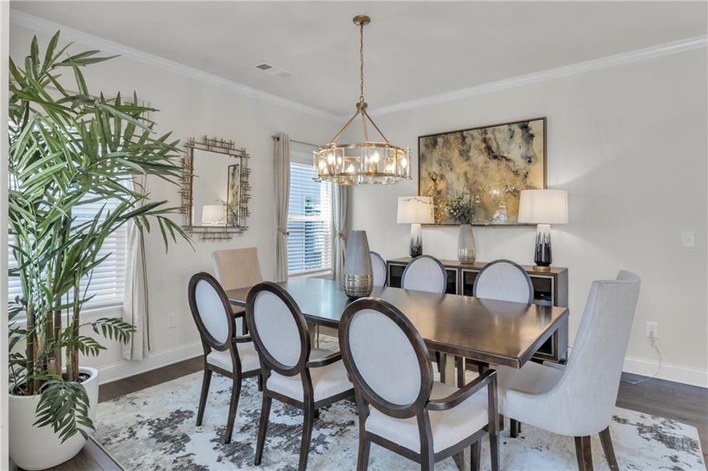 244 Wild Rose Circle Canton, GA 30115 - Photo 6 of 55 a view of a dining room with furniture window and wooden floor