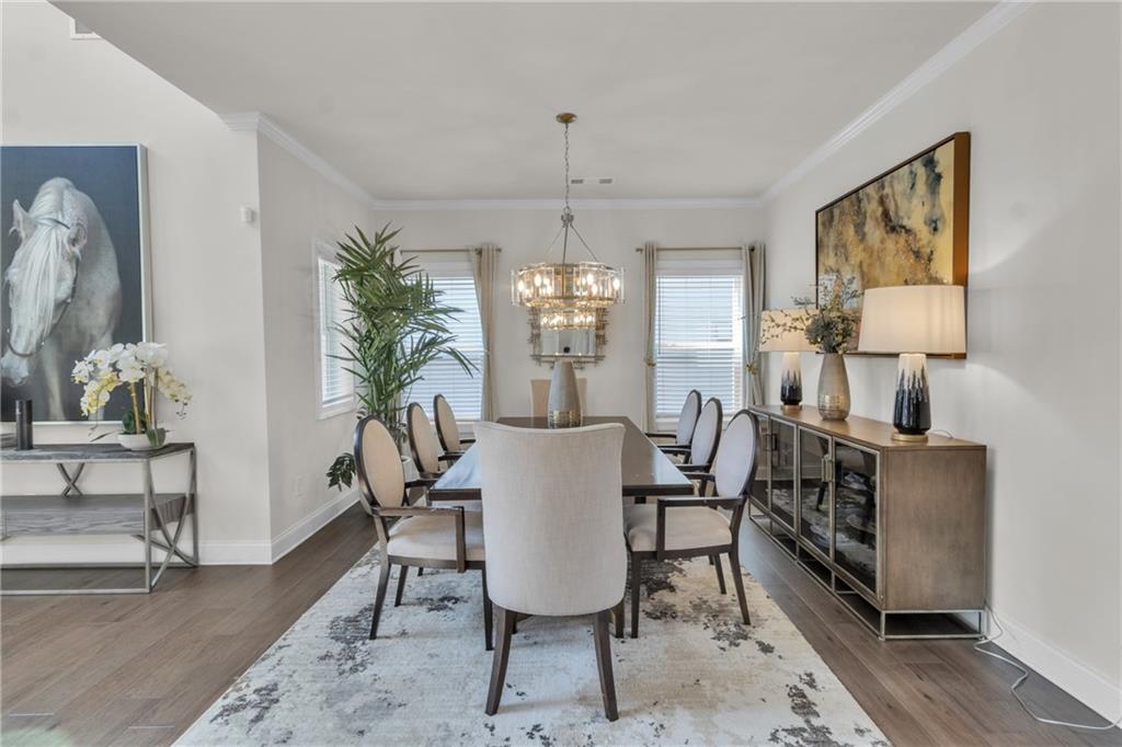 244 Wild Rose Circle Canton, GA 30115 - Photo 7 of 55 a view of a dining room with furniture and chandelier