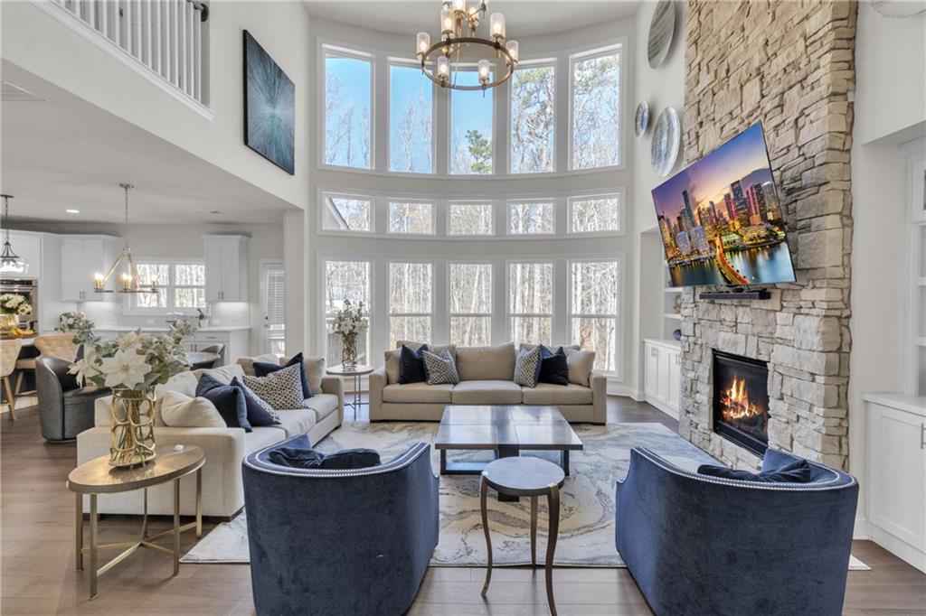 244 Wild Rose Circle Canton, GA 30115 - Photo 9 of 55 a living room with fireplace furniture and a large window