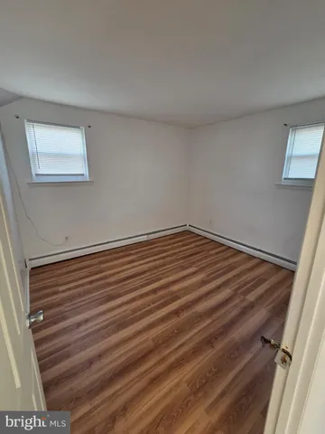 a view of small space with wooden floor