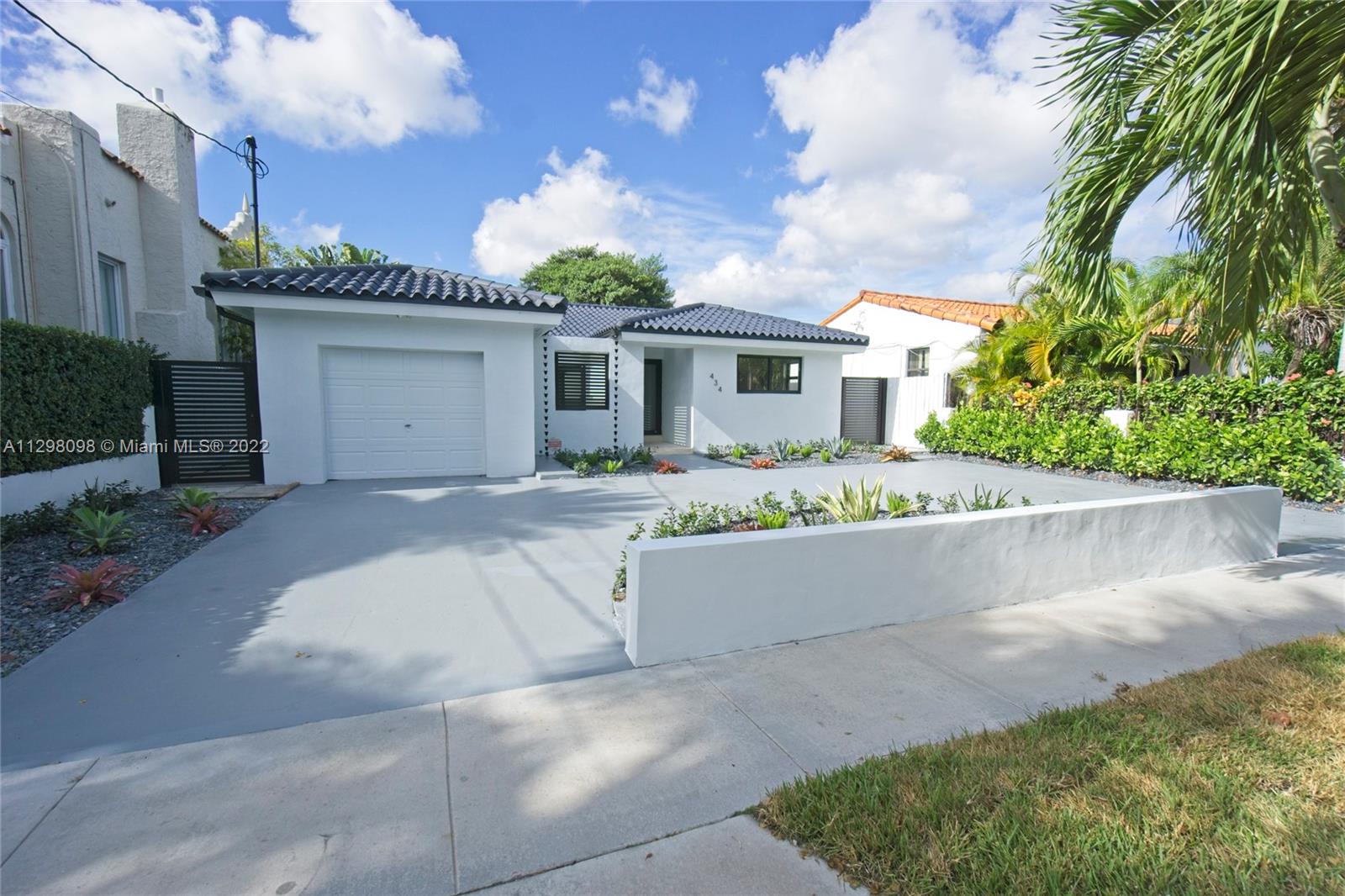 a front view of a house with yard