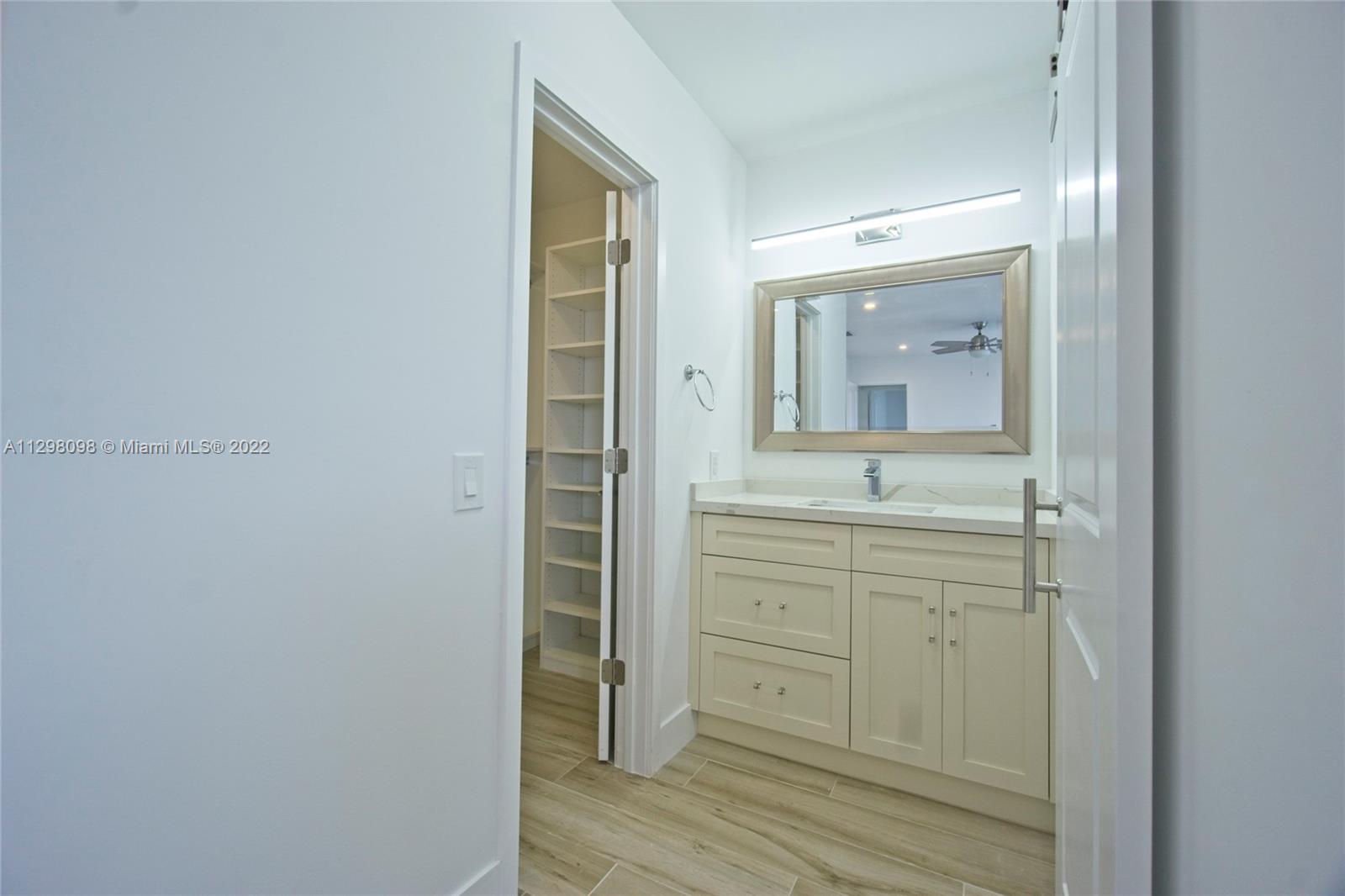 434 Southwest 23rd Road Miami, FL 33129 - Photo 11 of 32 a bathroom with a sink and a mirror