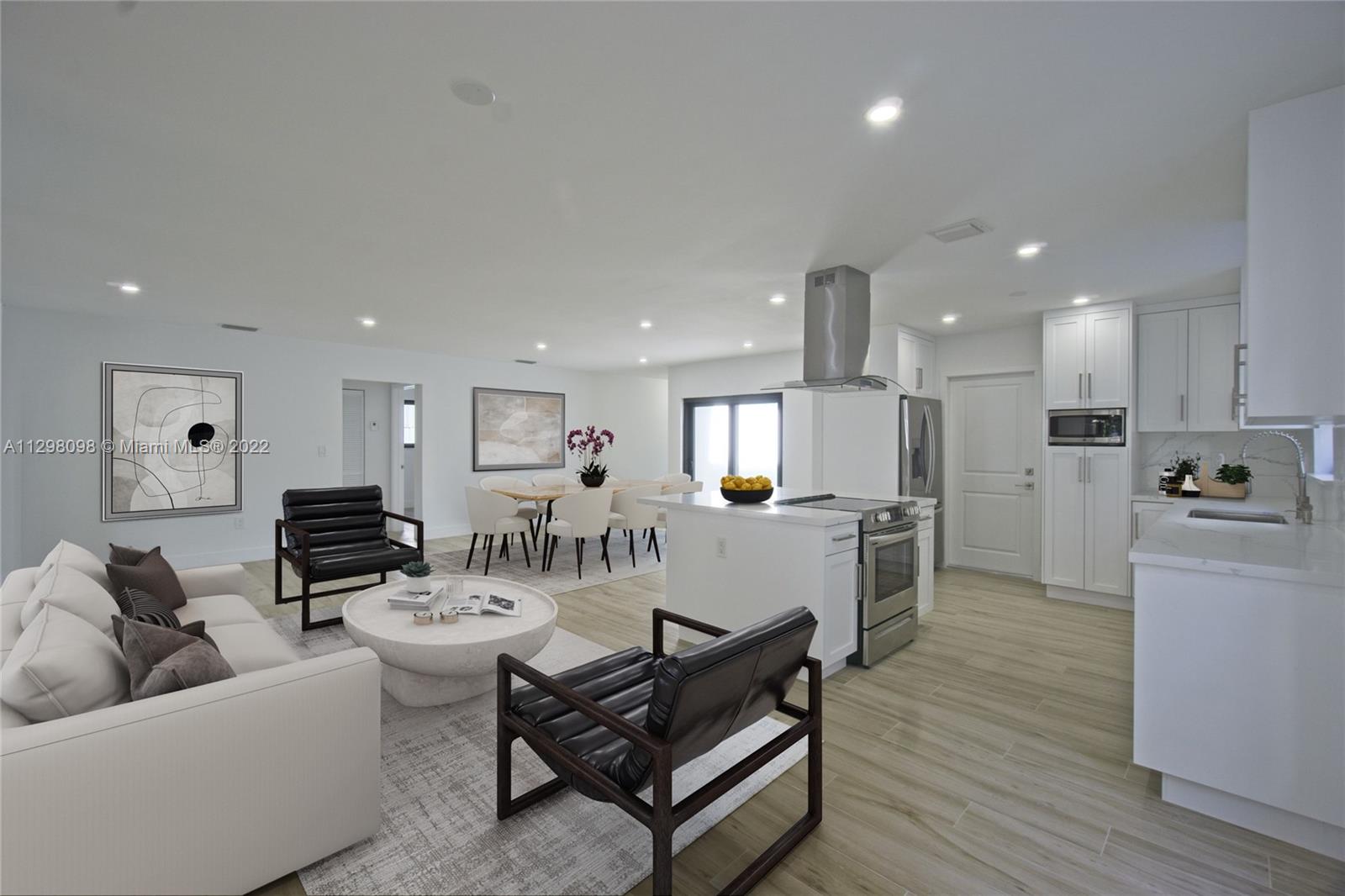 434 Southwest 23rd Road Miami, FL 33129 - Photo 2 of 32 a living room with furniture kitchen and a table