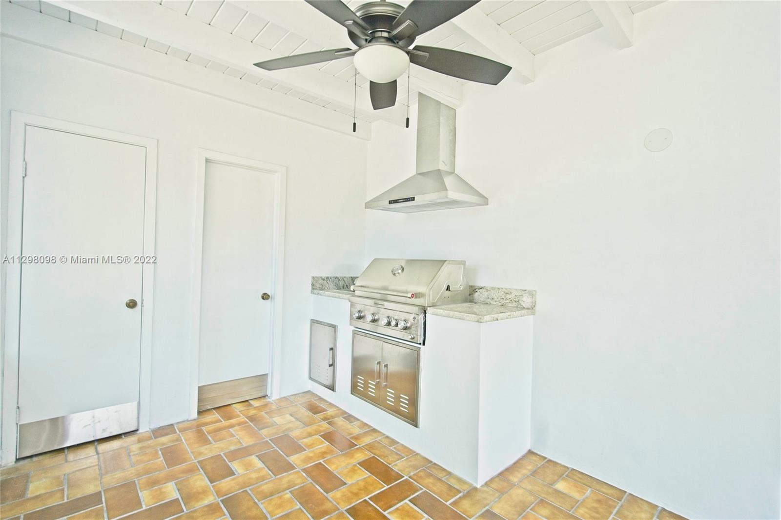 434 Southwest 23rd Road Miami, FL 33129 - Photo 24 of 32 a kitchen with stainless steel appliances a stove and a refrigerator