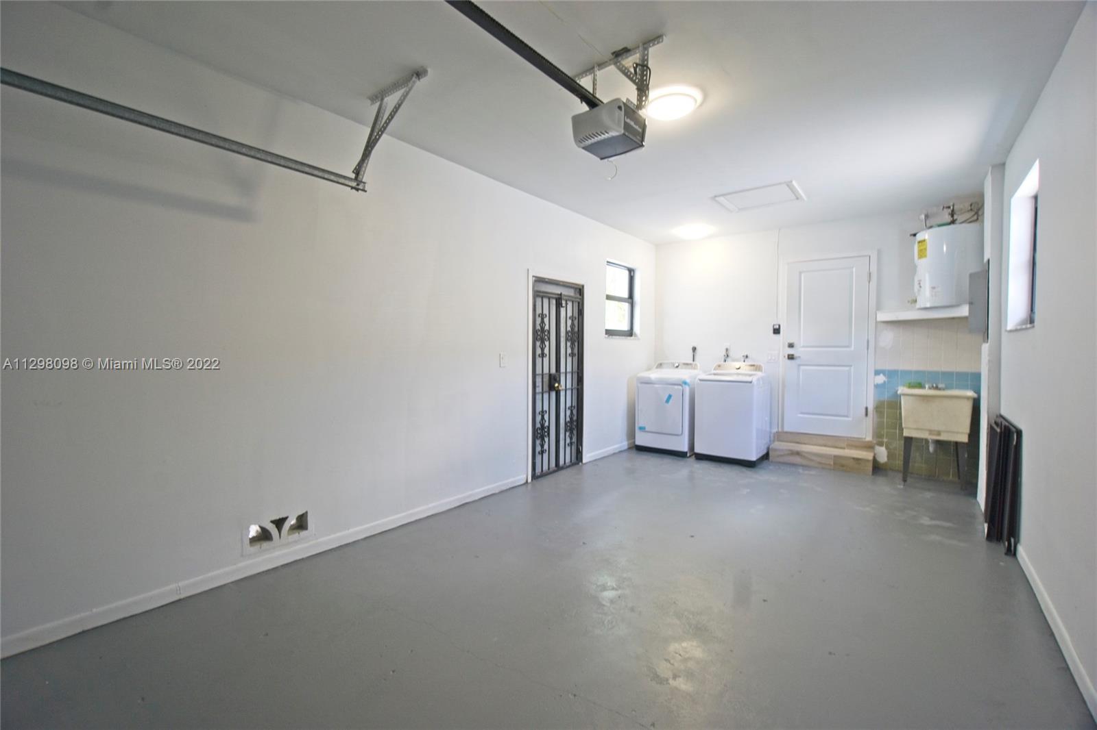 434 Southwest 23rd Road Miami, FL 33129 - Photo 29 of 32 a view of a room with cabinet a flat screen tv and fireplace