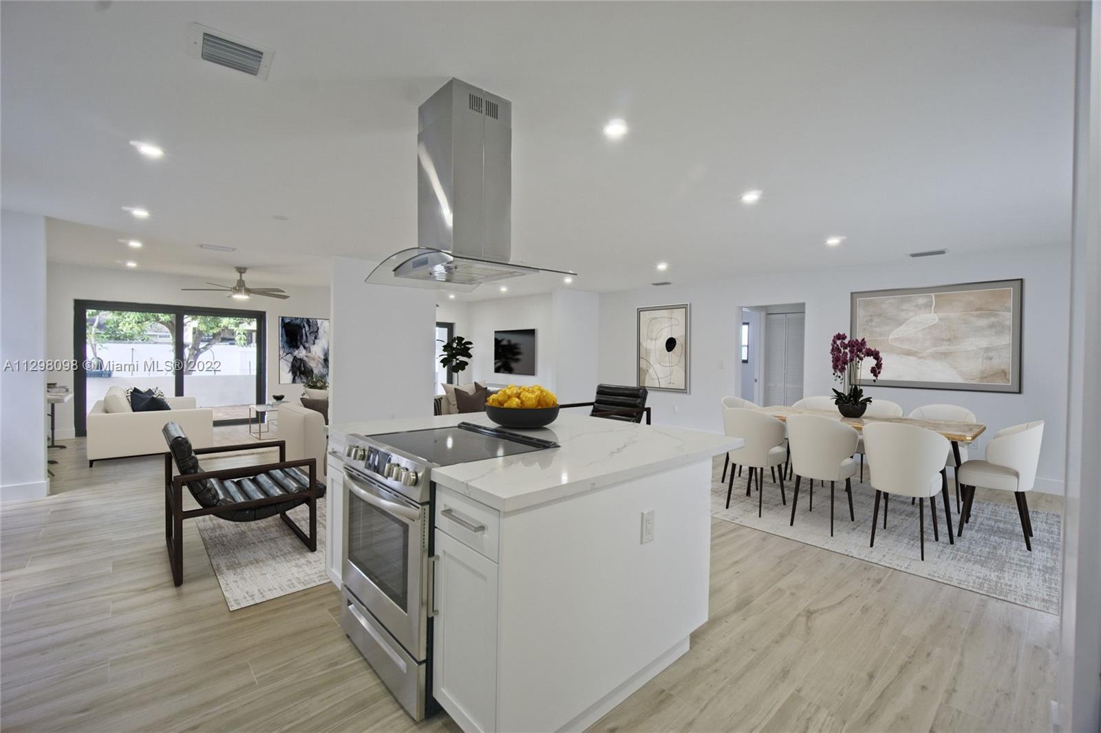 434 Southwest 23rd Road Miami, FL 33129 - Photo 4 of 32 a view of a dining room with furniture window and wooden floor