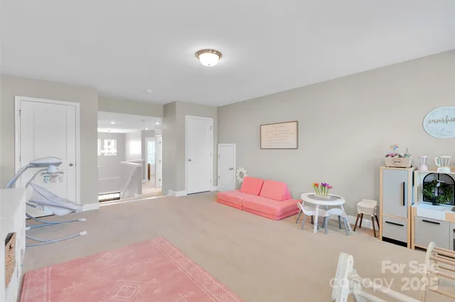 a bedroom with a bed and a chair