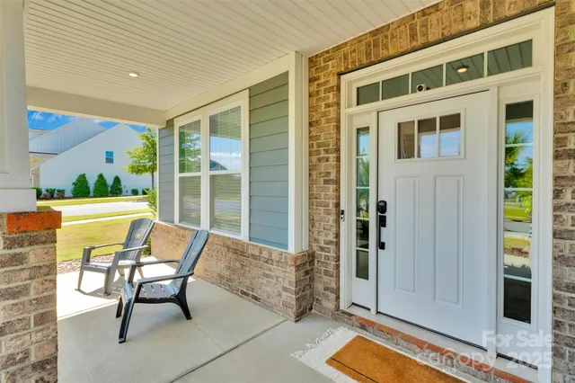 a balcony with table and chairs