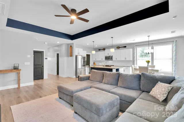 a view of a living room kitchen and a couch