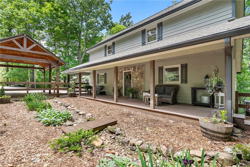 223 Denny Ridge Road Jasper, GA 30143 - Photo 1 of 54 a view of a house with backyard sitting area and garden