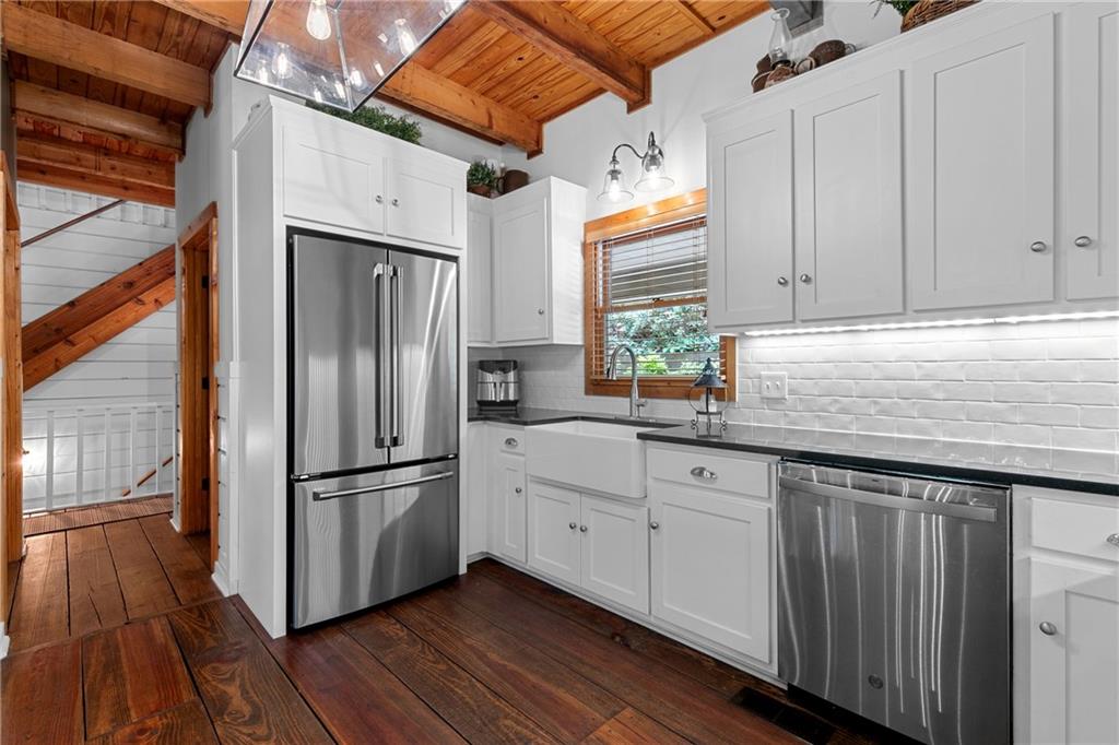 223 Denny Ridge Road Jasper, GA 30143 - Photo 11 of 54 a kitchen with granite countertop a refrigerator and a sink