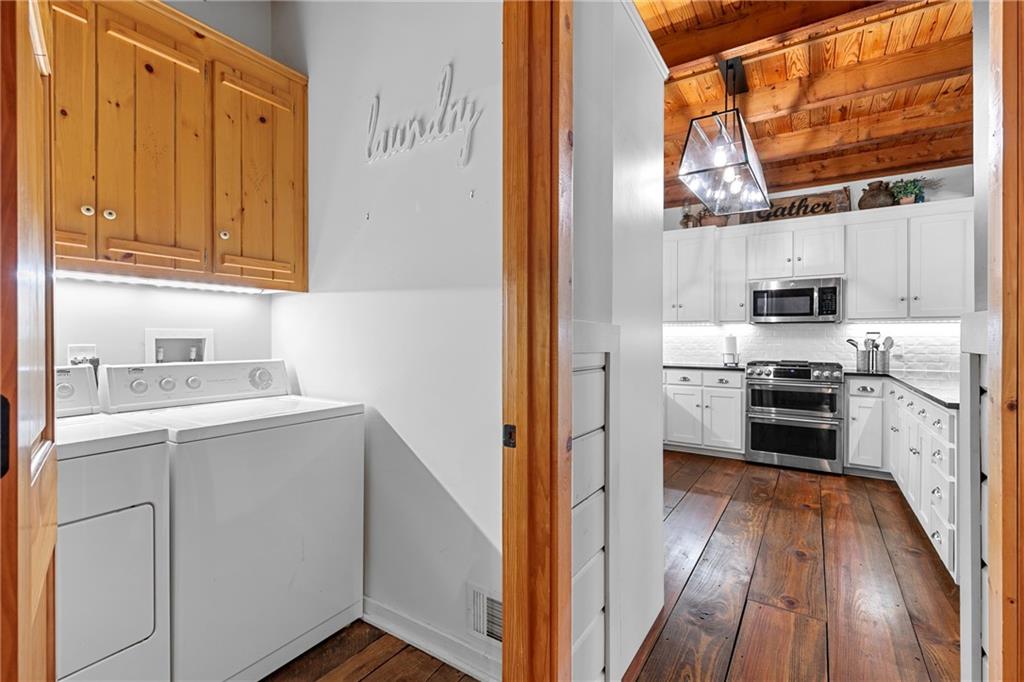 223 Denny Ridge Road Jasper, GA 30143 - Photo 13 of 54 a kitchen with stainless steel appliances a stove top oven a sink and a refrigerator