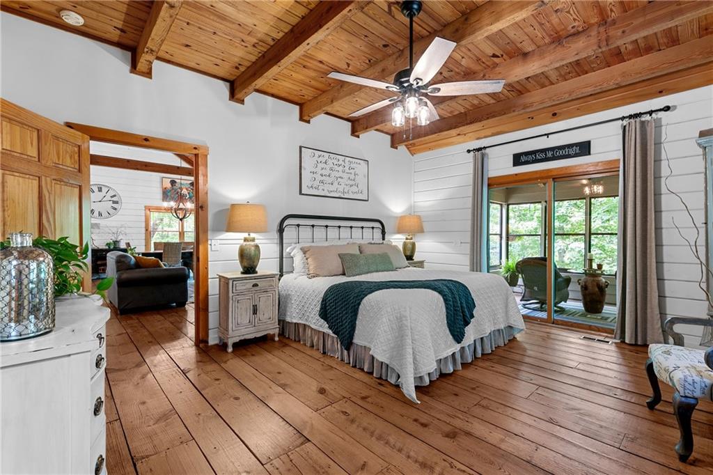 223 Denny Ridge Road Jasper, GA 30143 - Photo 14 of 54 a bedroom with a bed and wooden floor