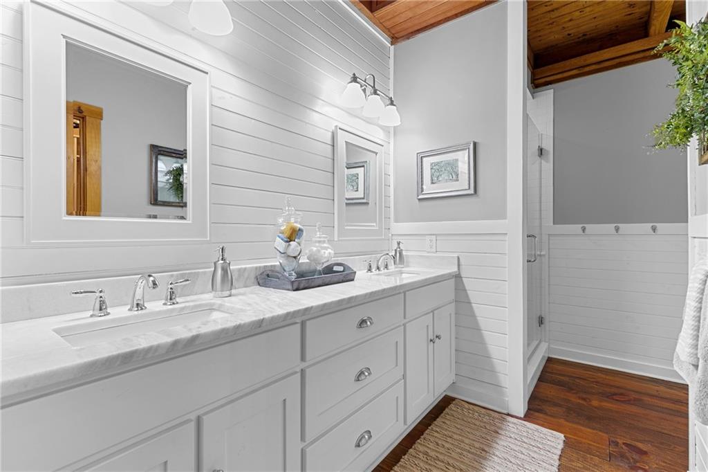 223 Denny Ridge Road Jasper, GA 30143 - Photo 16 of 54 a bathroom with a double vanity sink and a mirror