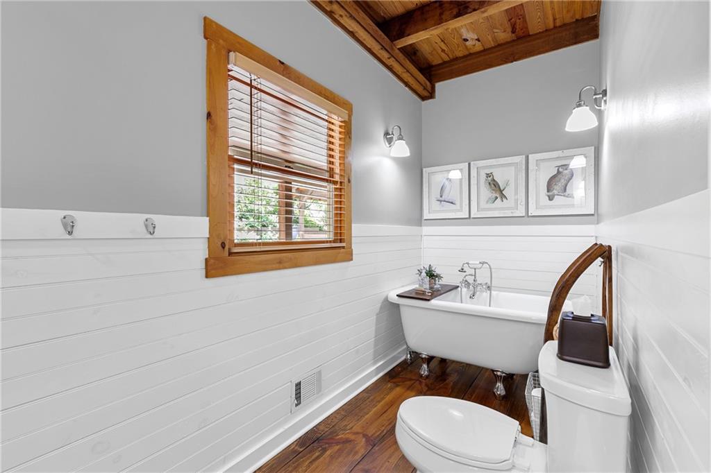 223 Denny Ridge Road Jasper, GA 30143 - Photo 17 of 54 a bathroom with a toilet a sink and mirror