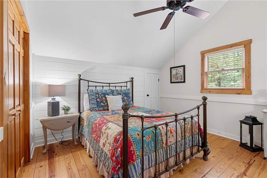 223 Denny Ridge Road Jasper, GA 30143 - Photo 20 of 54 a bedroom with a bed and wooden floor