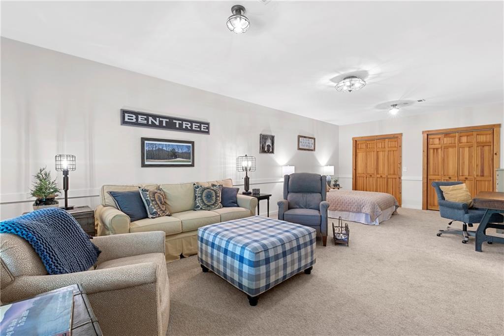 223 Denny Ridge Road Jasper, GA 30143 - Photo 27 of 54 a living room with furniture large window and a lamp