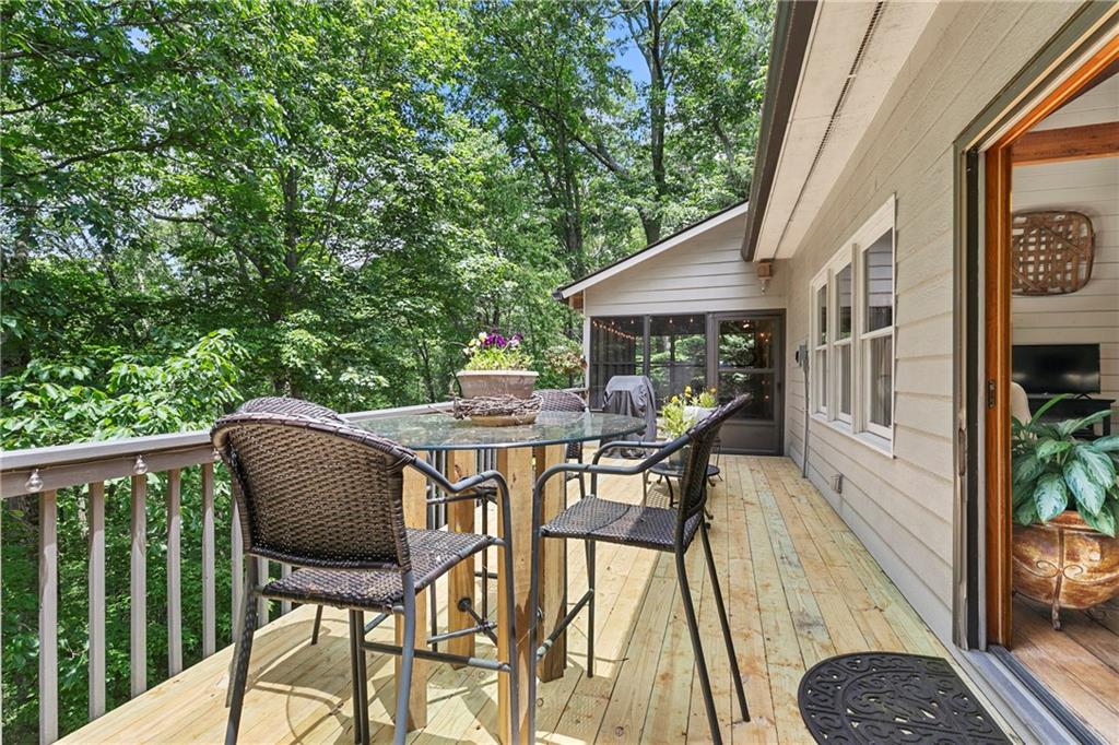 223 Denny Ridge Road Jasper, GA 30143 - Photo 28 of 54 a view of a chairs and table in the balcony