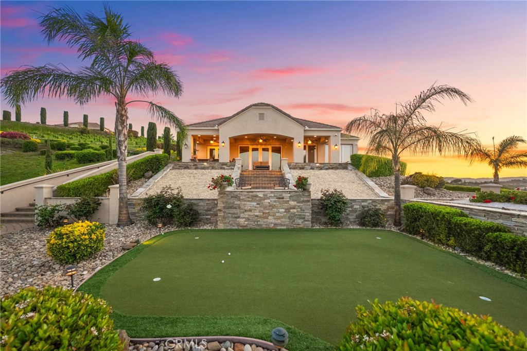 44195 Sunset Terrace Temecula, CA 92590 - Photo 20 of 74 a view of a house with a big yard and potted plants