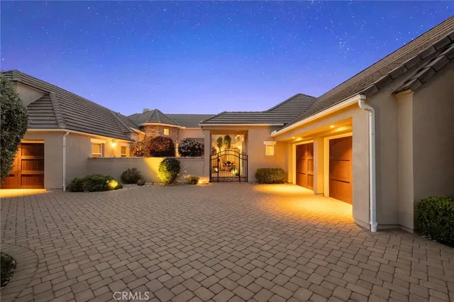 a bathroom with a granite countertop toilet a sink and a mirror