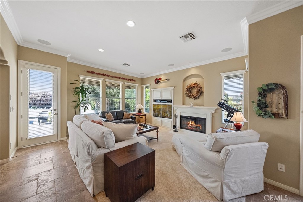 44195 Sunset Terrace Temecula, CA 92590 - Photo 26 of 74 a living room with furniture a fireplace and a large window