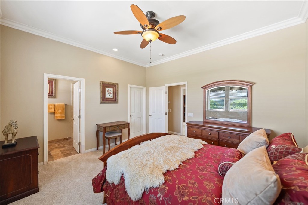 44195 Sunset Terrace Temecula, CA 92590 - Photo 31 of 74 a bedroom with a bed and dresser with wooden floor