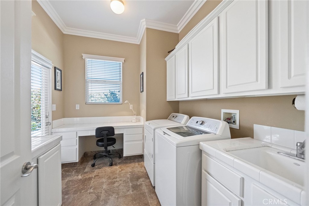 44195 Sunset Terrace Temecula, CA 92590 - Photo 35 of 74 a view of a storage & utility room with washer and dryer