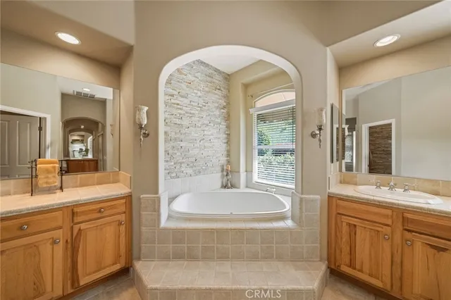 a living room with pool table furniture and a floor to ceiling window