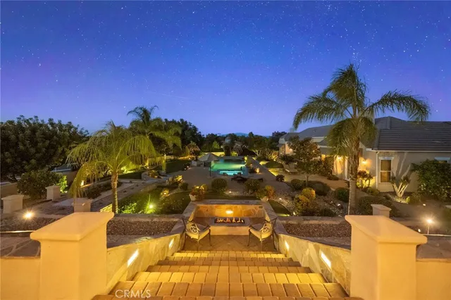 a view of a backyard with sitting area