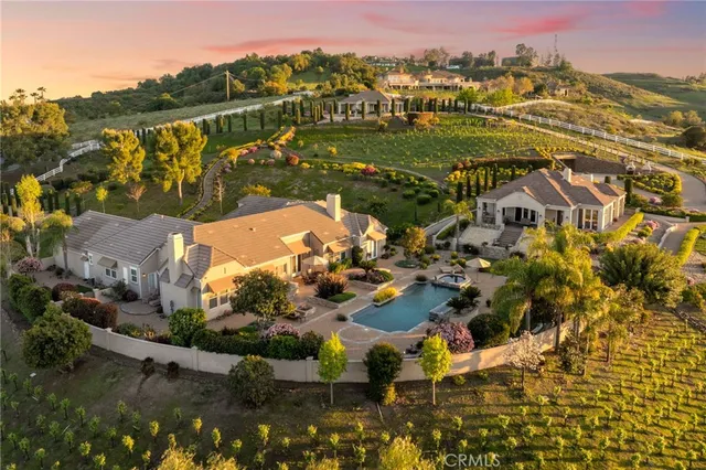 a view of a chair and tables in the patio