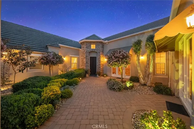 a view of a swimming pool with a yard