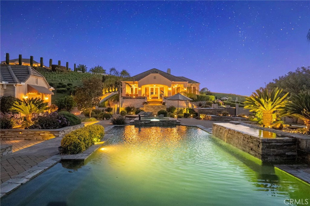 44195 Sunset Terrace Temecula, CA 92590 - Photo 9 of 74 a view of a swimming pool with an outdoor space and seating area