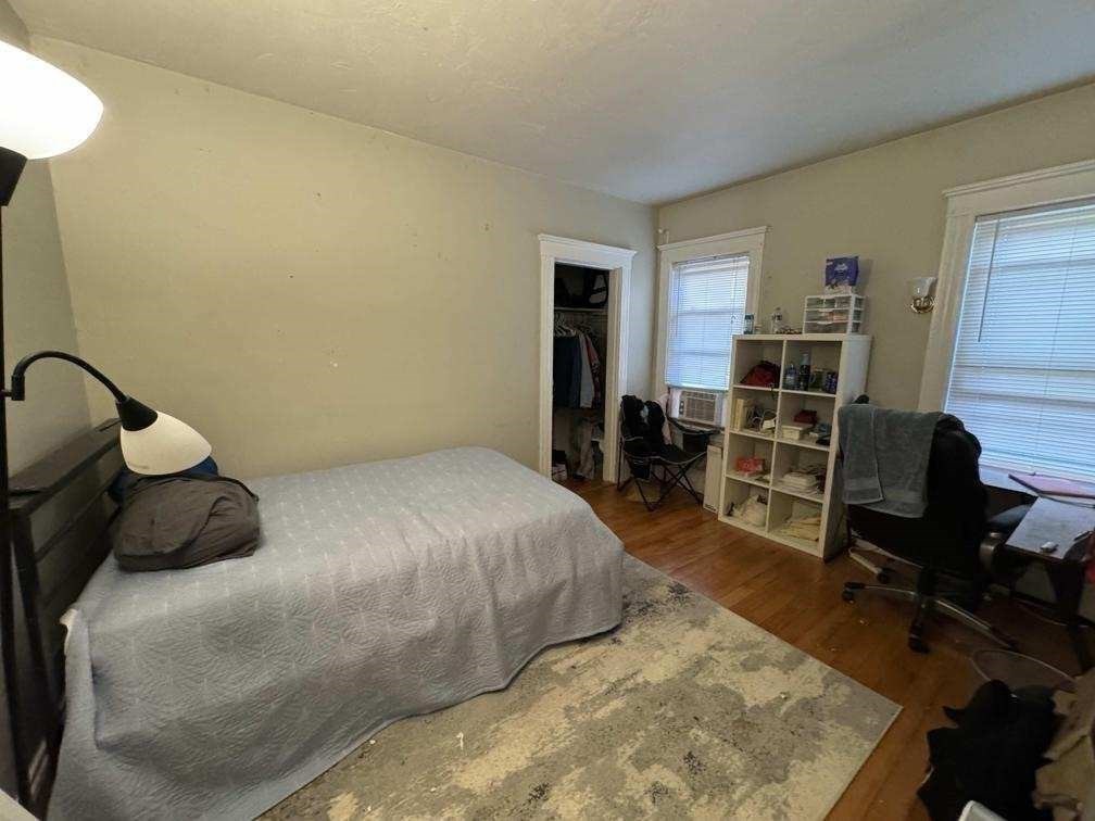 28 Sunset Road, Unit 1 Somerville, MA 02144 - Photo 11 of 15 a bedroom with a bed and a workspace