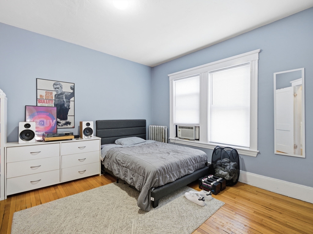 28 Sunset Road, Unit 1 Somerville, MA 02144 - Photo 12 of 33 a bedroom with a bed and window