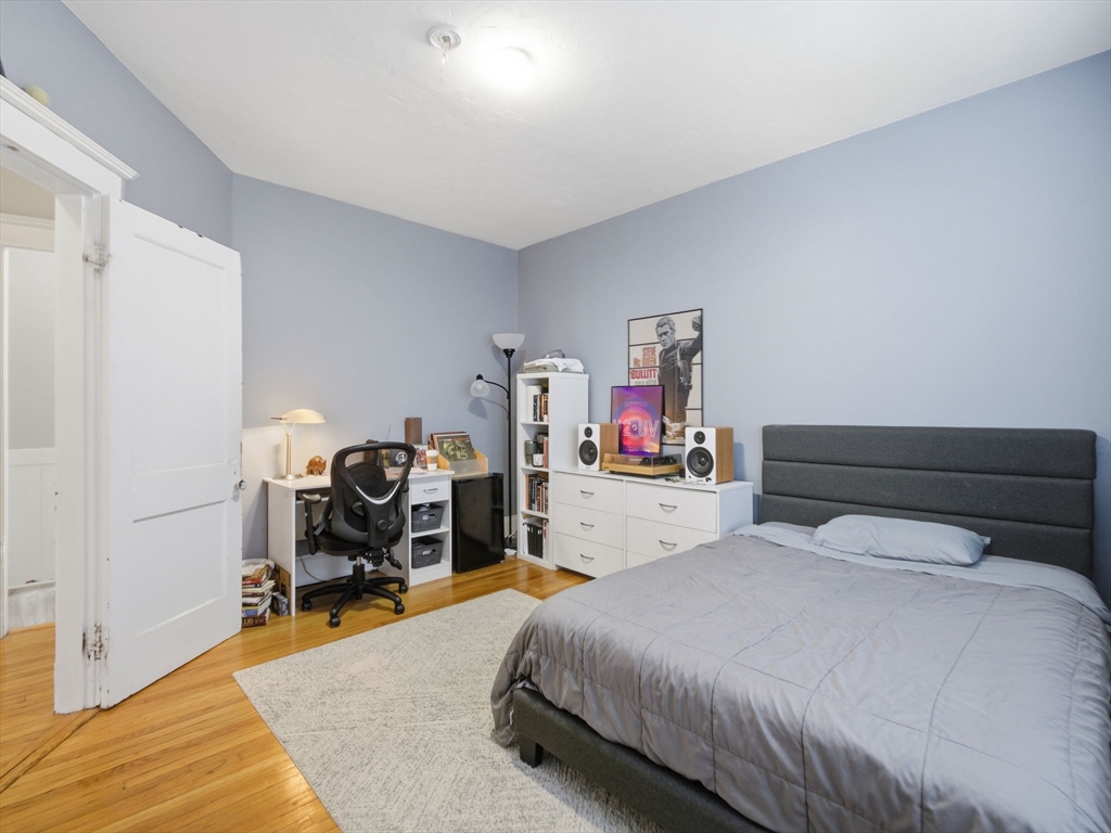 28 Sunset Road, Unit 1 Somerville, MA 02144 - Photo 13 of 33 a bedroom with a bed and a desk