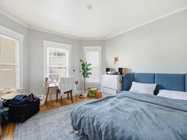 a bedroom with a bed and a tv in it