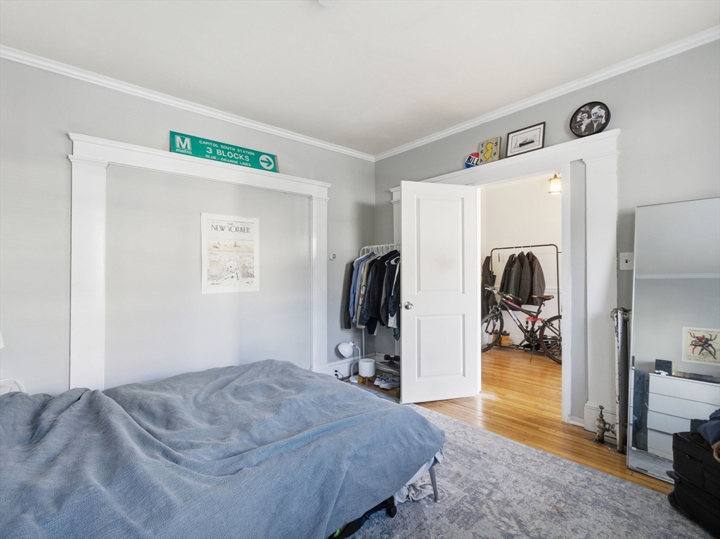 28 Sunset Road, Unit 1 Somerville, MA 02144 - Photo 19 of 33 a bedroom with a bed and a view of bedroom