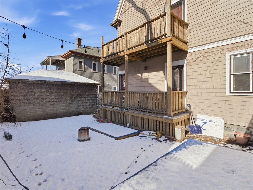 28 Sunset Road, Unit 1 Somerville, MA 02144 - Photo 28 of 33 a view of a house with wooden fence