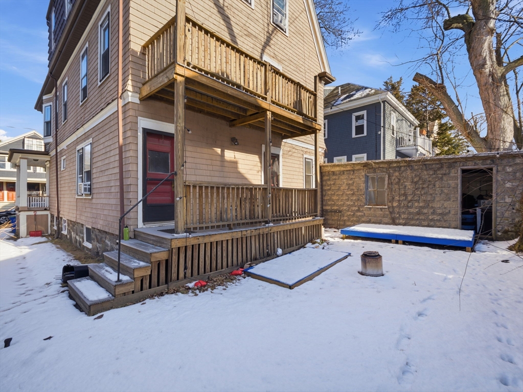 28 Sunset Road, Unit 1 Somerville, MA 02144 - Photo 30 of 33 a view of a building with iron fence